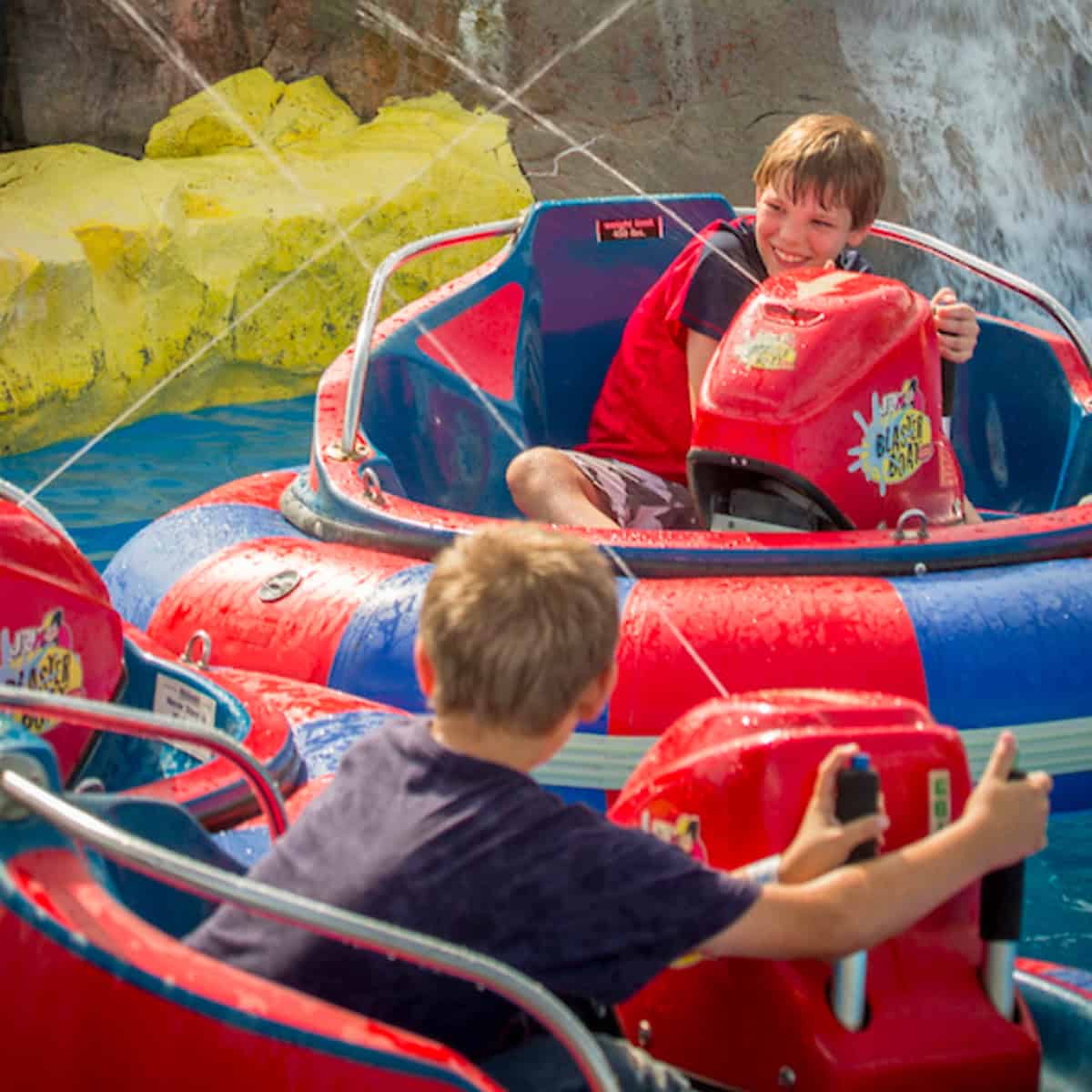 Guests enjoying high-speed go-kart rides at NASCAR Speedpark