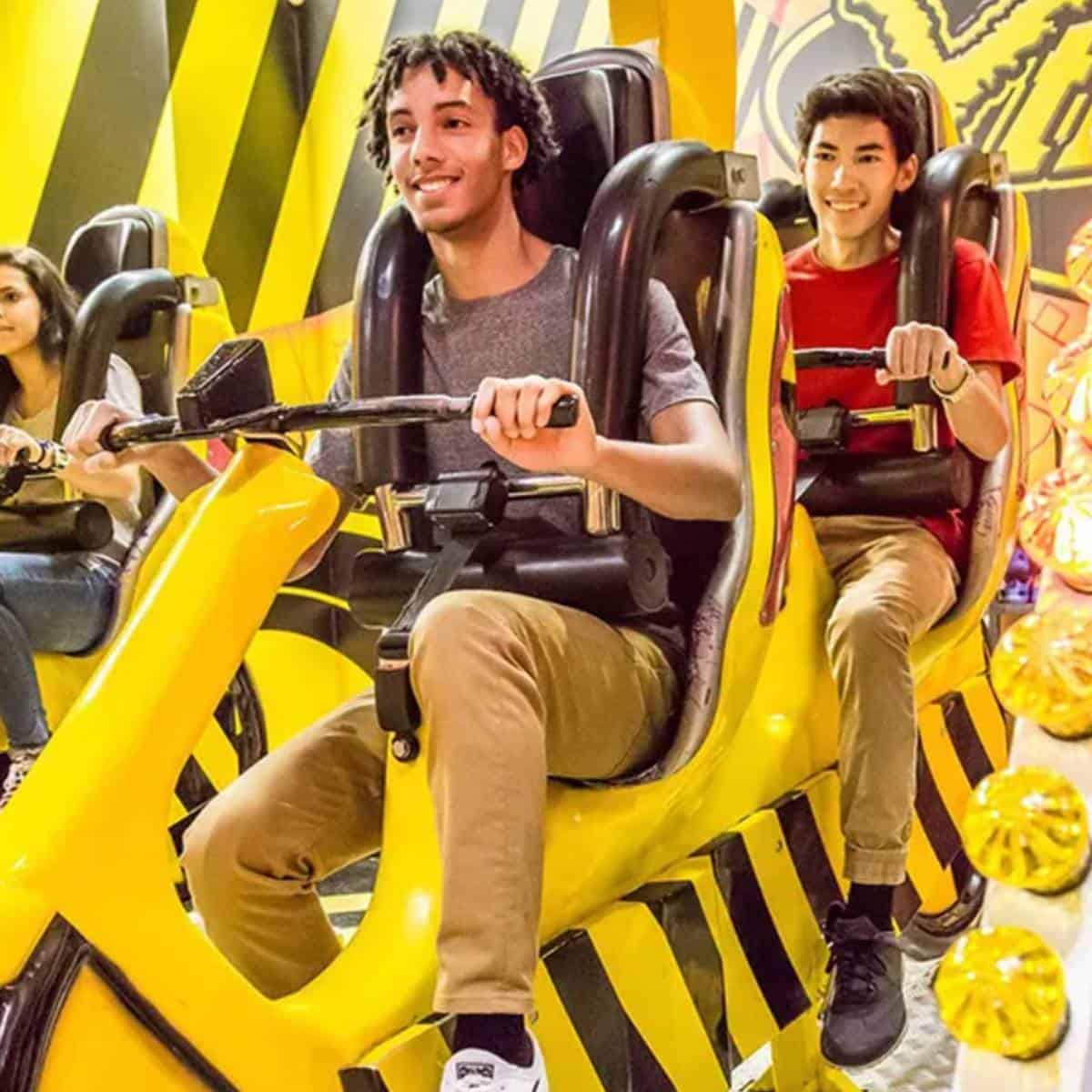 Guests enjoying amusement rides at Pavilion Park