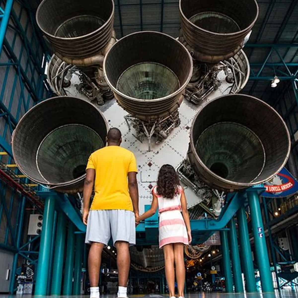 Children operating a simulated space mission control station
