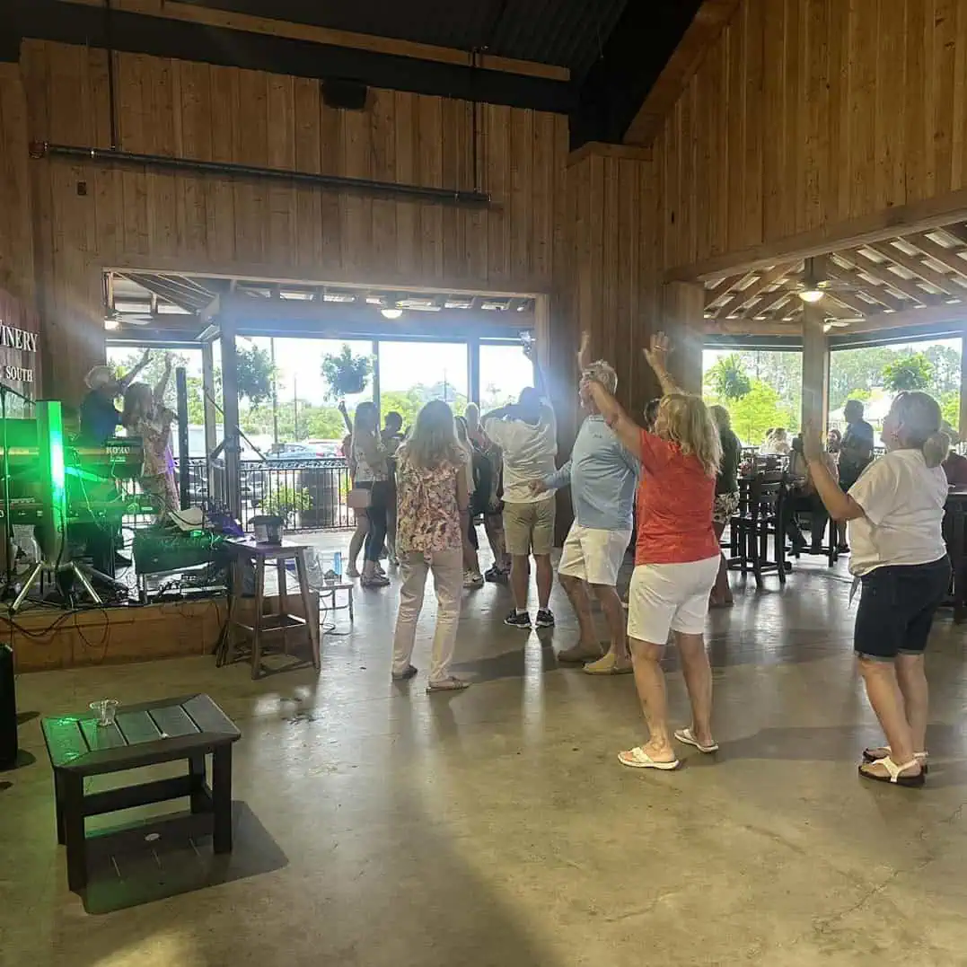 Duplin Winery Panama City Beach tasting room with wine samples and guests enjoying the experience