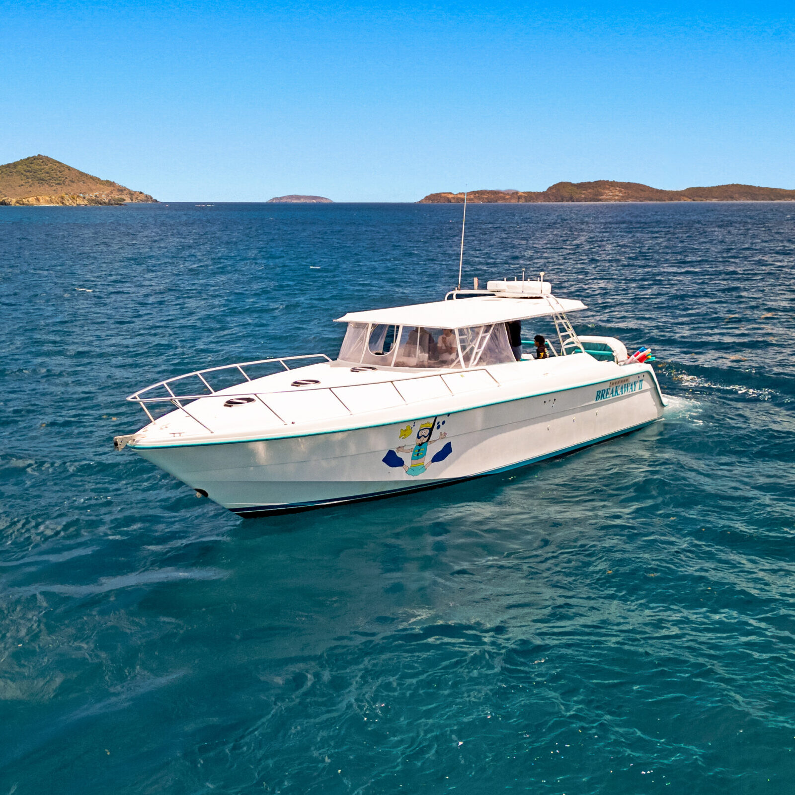 Snorkelers exploring clear Caribbean waters near St. John