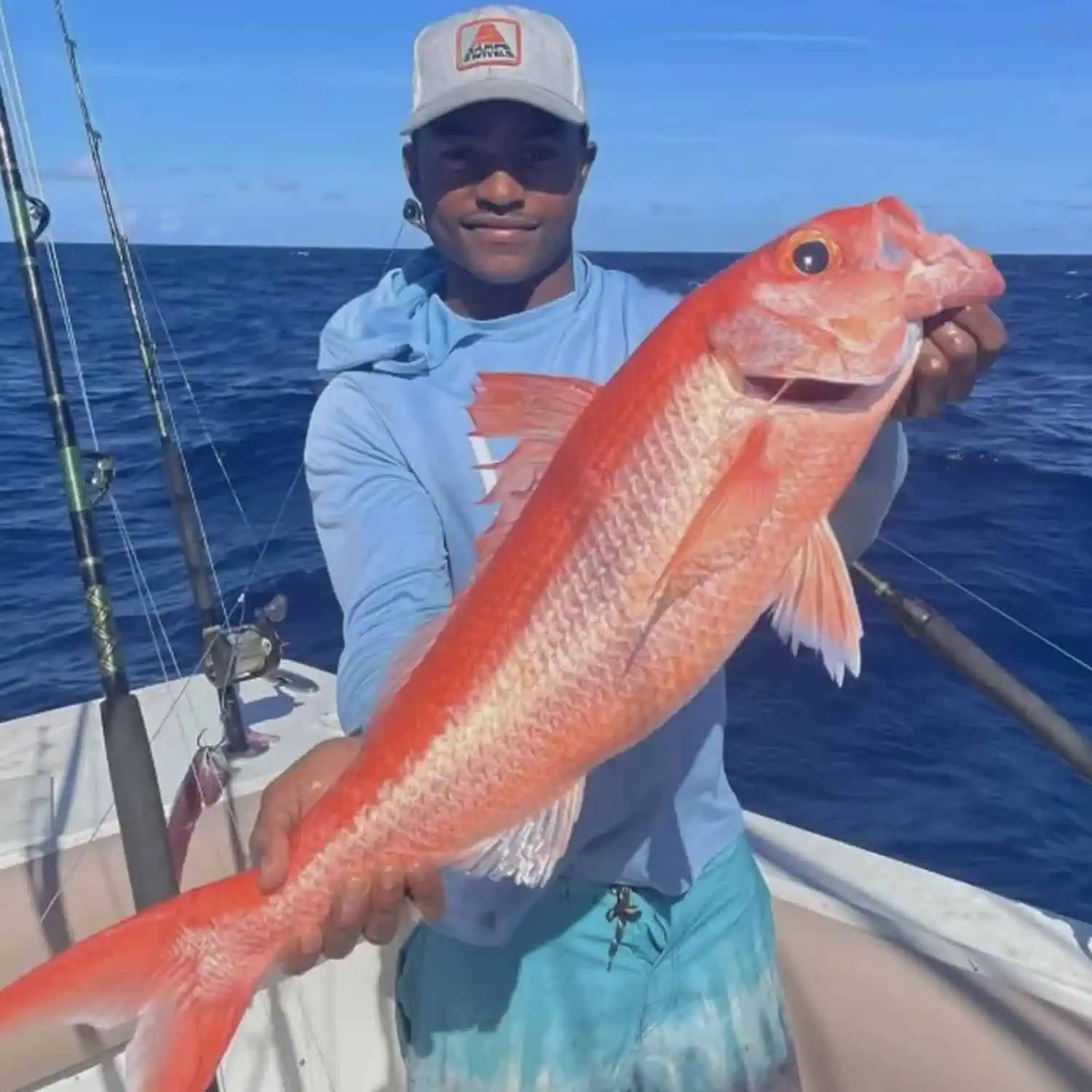 Visitors catching coastal fish on an inshore fishing excursion with Neptune Fishing Supplies.
