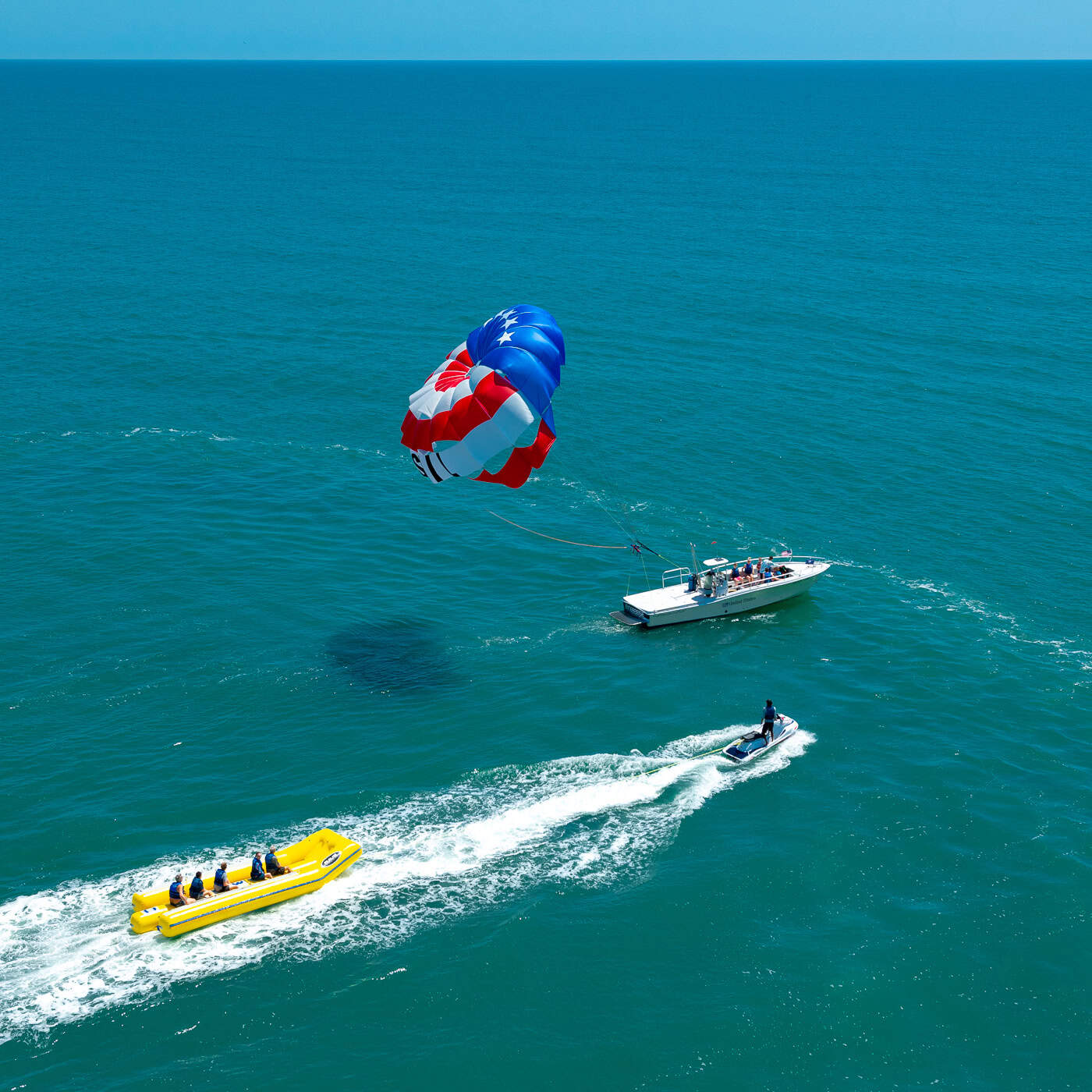 Parasailing adventure over clear blue water