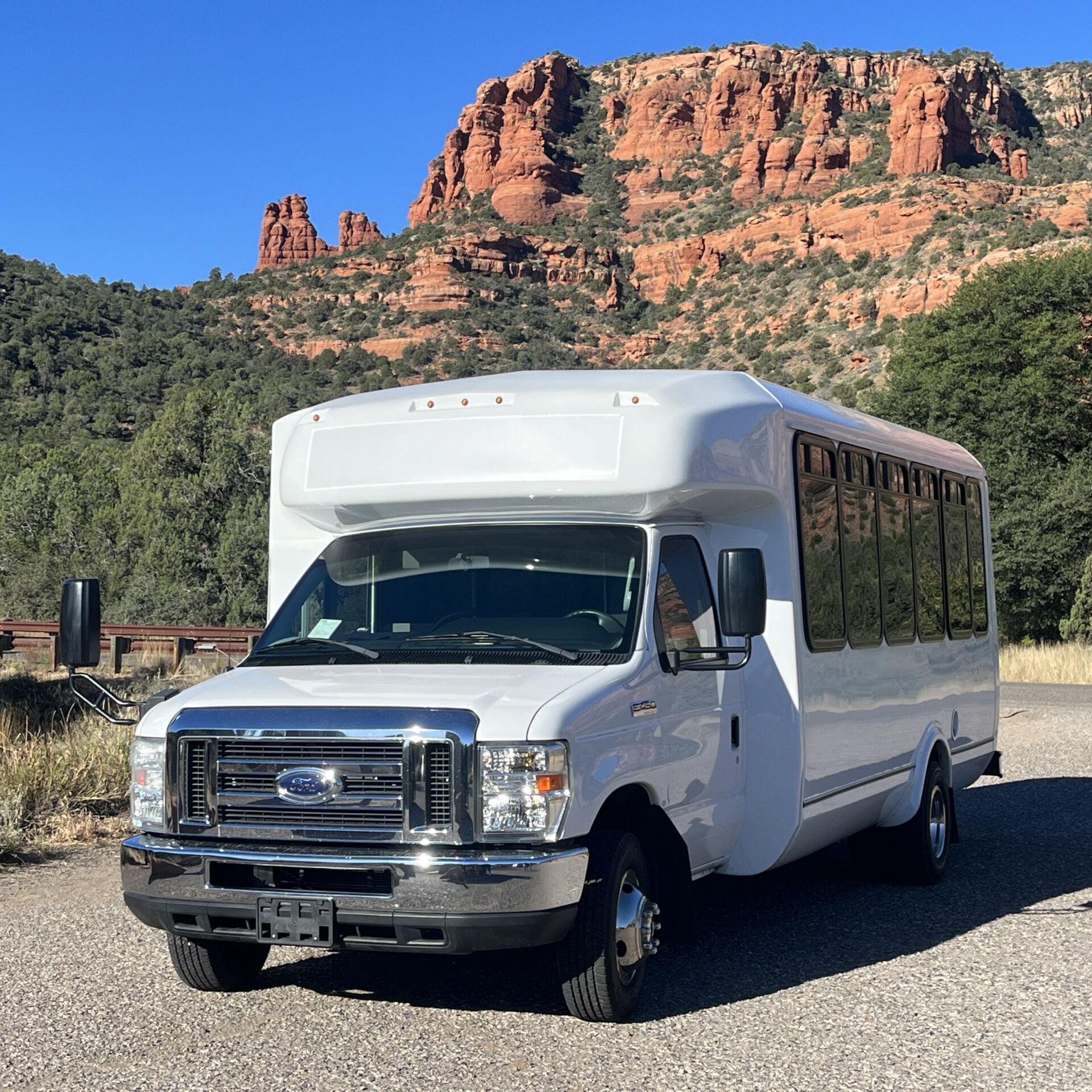 Red Rock Magic Trolley parked at a scenic overlook surrounded by Arizona red rocks